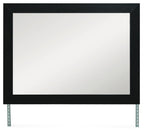 Black rectangular bedroom mirror with dark frame and metal support legs