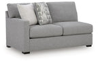 Pewter gray left-arm sofa with two seats, armrest, and patterned throw pillows