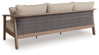 Sofa with cushions in natural beige with woven gray lower panel and two back pillows