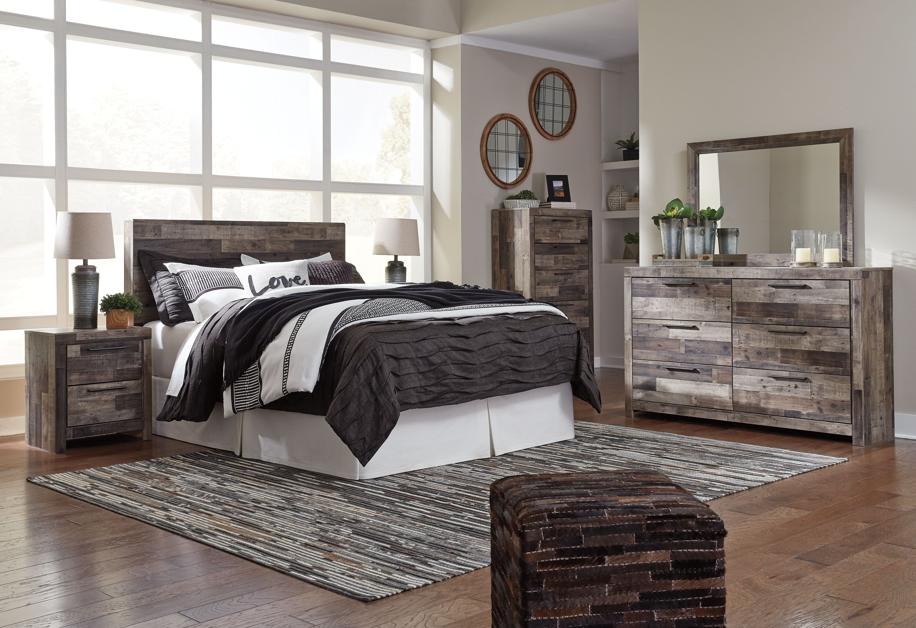 Two-drawer night stand with gray wood-look panels and two bar-handled drawers.