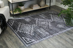 Arloman - 5' x 7' Rug - Black / Cream / Gray