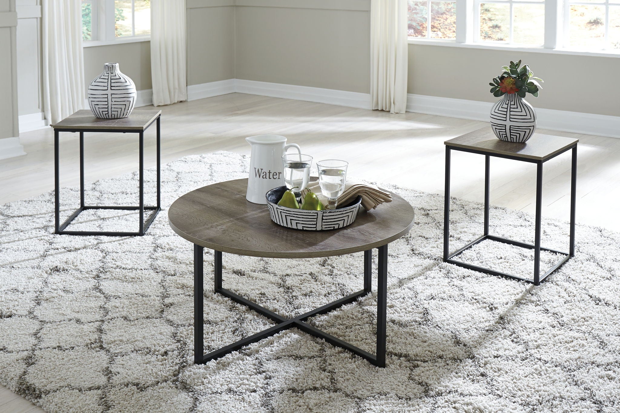 Occasional table set of 3 with round brown tabletops and black metal frames
