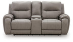 Gray power reclining loveseat with wide back cushions and padded armrests