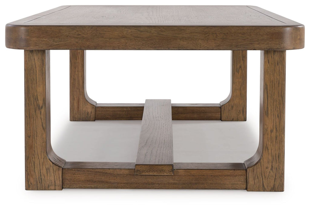 Rectangular light brown wood cocktail table with arched apron opening and lower shelf