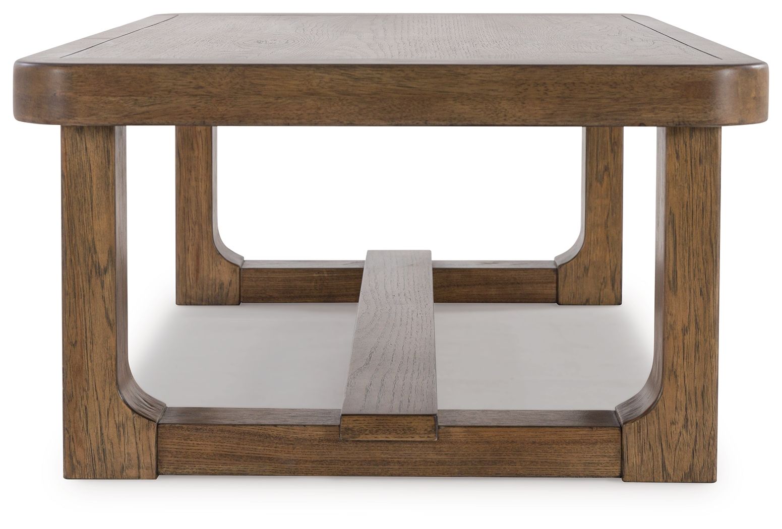 Rectangular light brown wood cocktail table with arched apron opening and lower shelf