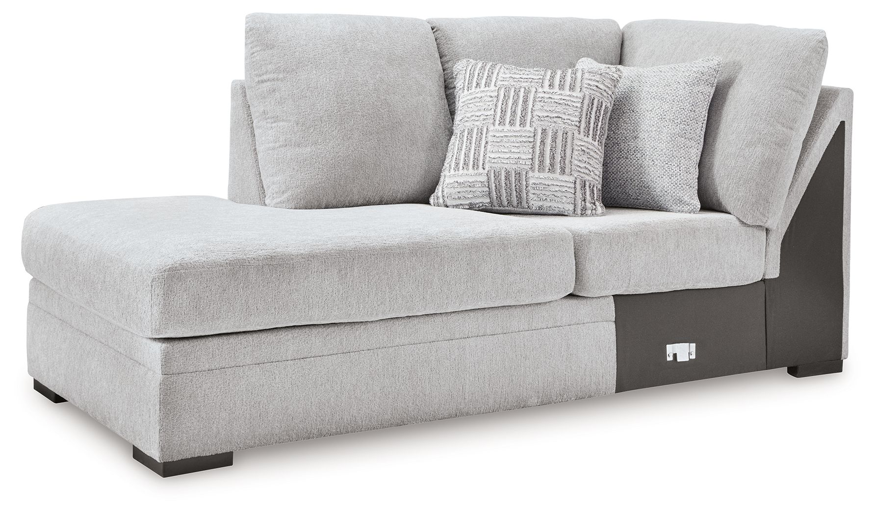 Left-arm corner chaise in light gray upholstery with dark block base and pillows