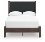 Upholstered panel platform bed with dark headboard, white mattress, and two pillows