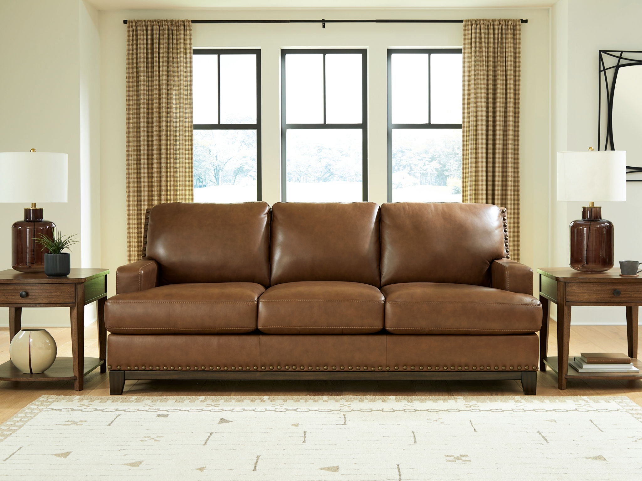 Saonara amber sofa with three seat cushions, three back cushions, and stitched apron