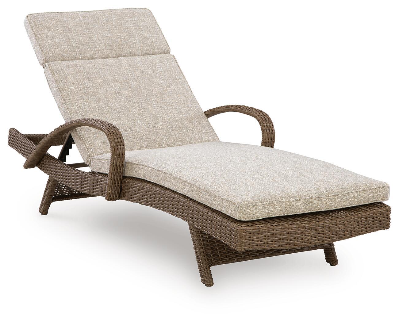 Beige chaise lounge with cushion, woven wicker frame and reclining back