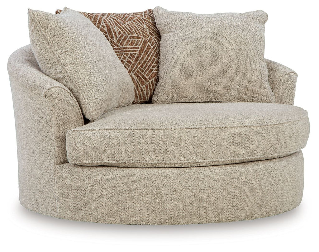Oversized swivel accent chair in light beige fabric with rounded arms and thick seat