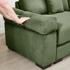 Green corduroy sectional sofa arm with ottoman-style seat detail