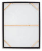 Back view of framed wall art with white backing and wooden corner braces