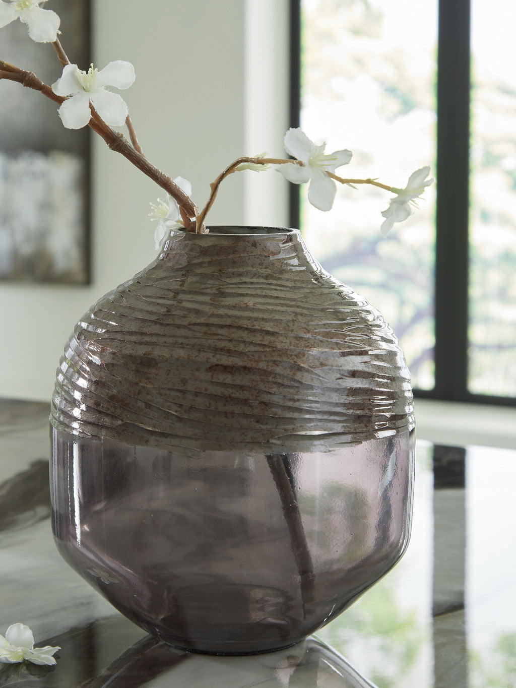 Harpwick dark gray glass vase with white blossoms on stems