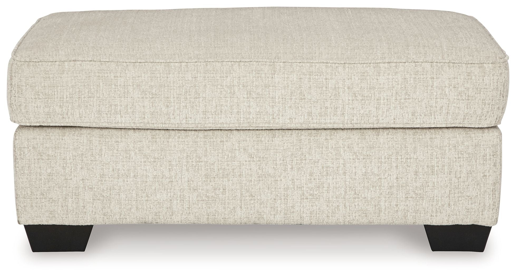 Light beige upholstered ottoman front view with dark legs