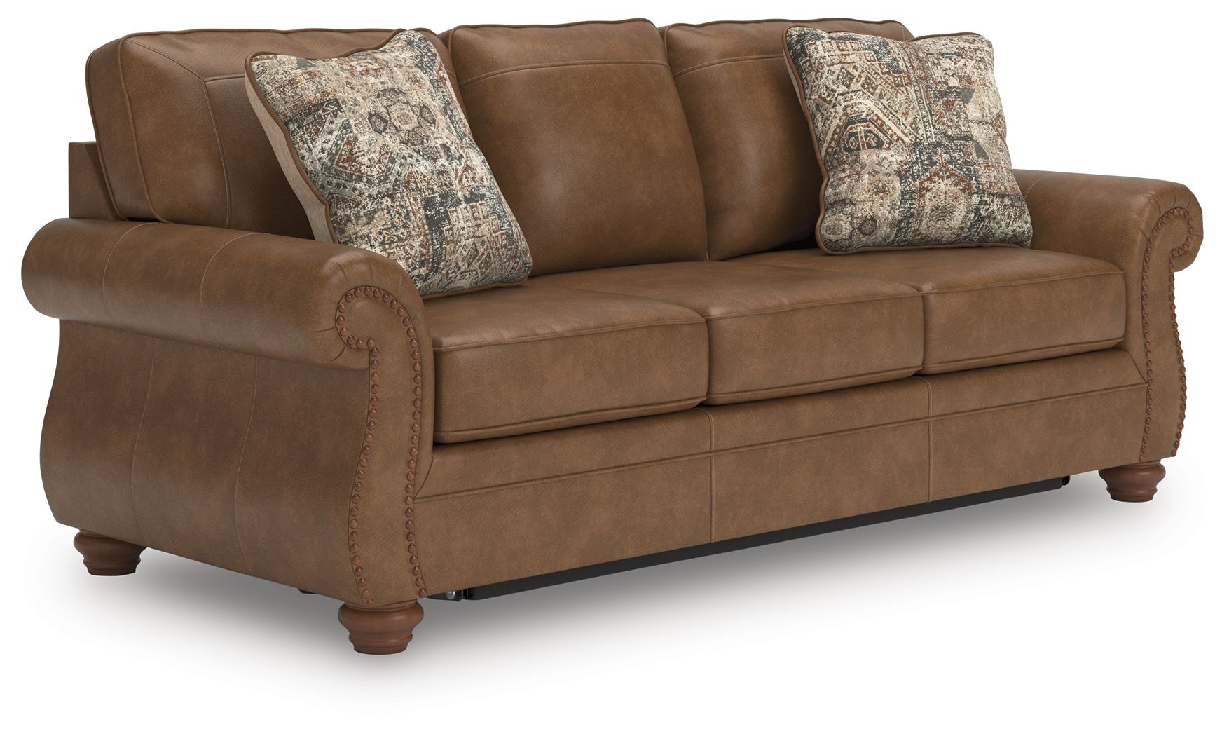Brown sofa sleeper with three seat cushions and two patterned throw pillows