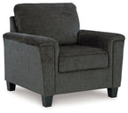 Dark gray upholstered armchair with curved arms and tall backrest