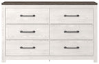 White wood dresser with six drawers and black bar pulls, dark wood top