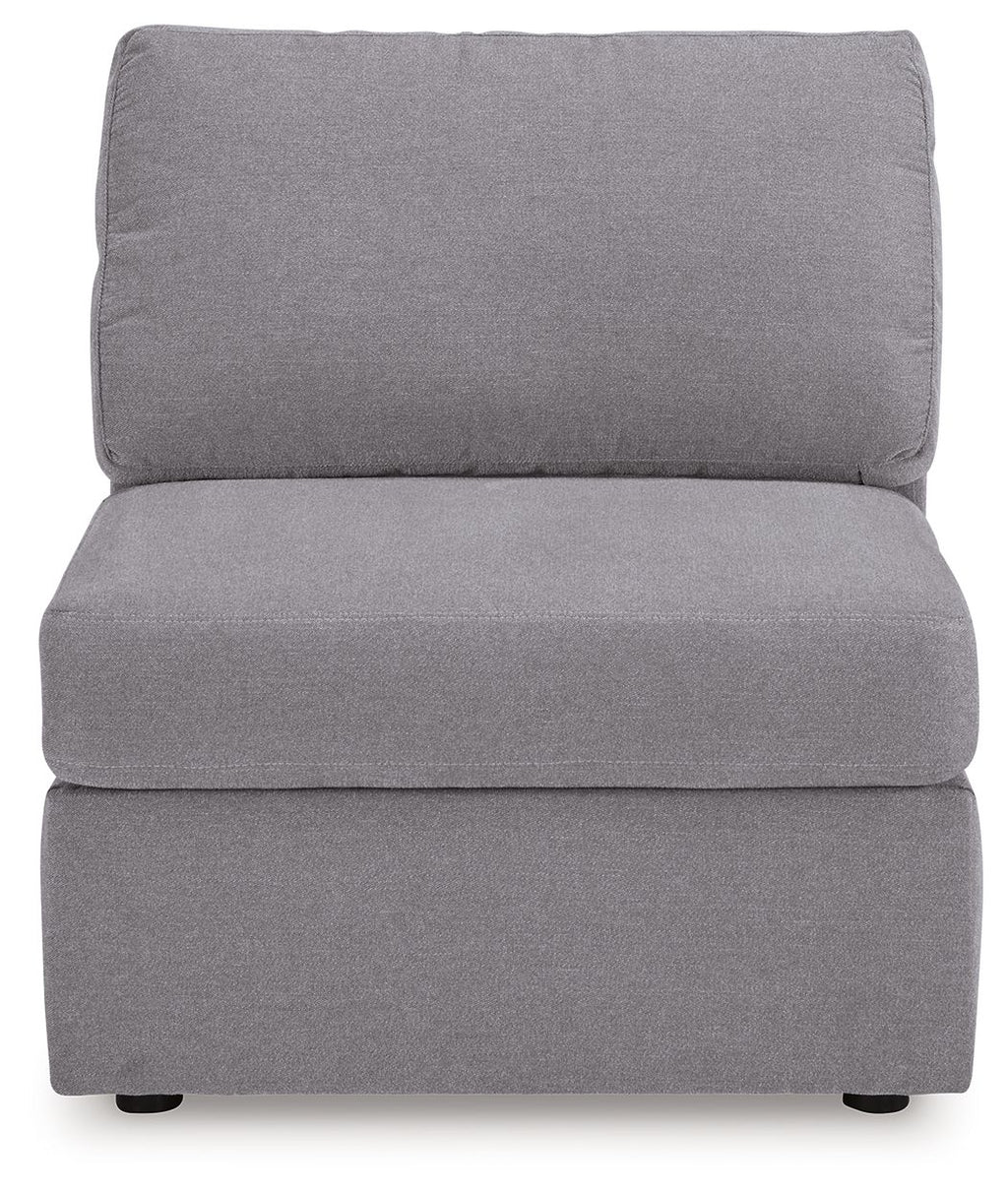Gray armless chair with tall backrest and padded seat, upholstered in textured fabric