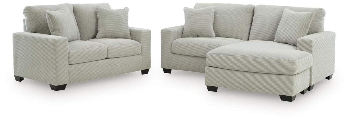 Light gray sofa chaise and loveseat set with rounded square arms and thick cushions