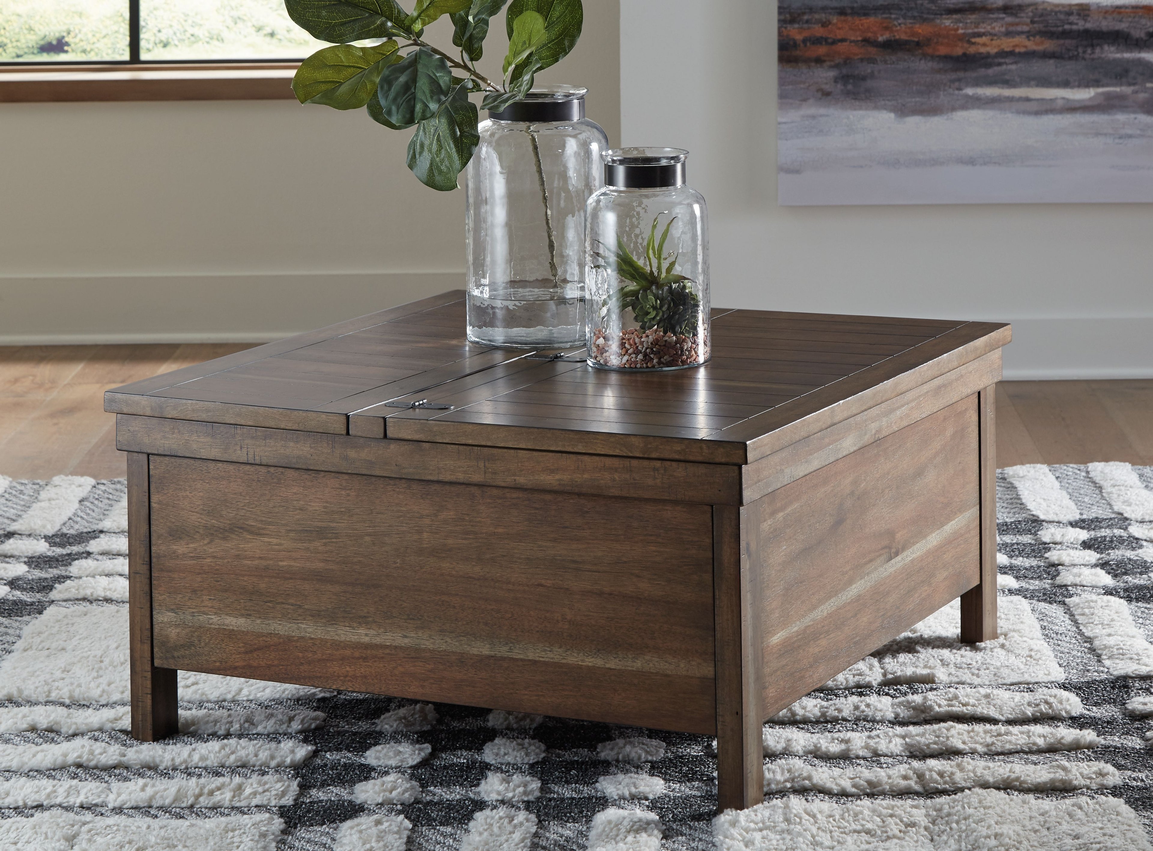 Grayish-brown wood lift-top cocktail table with paneled drawer and hinged top
