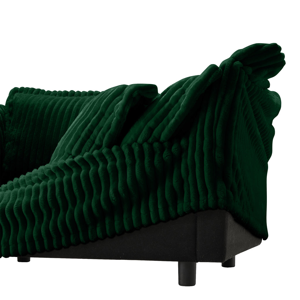 Green sectional sofa arm and seat corner with ribbed fabric and rounded base