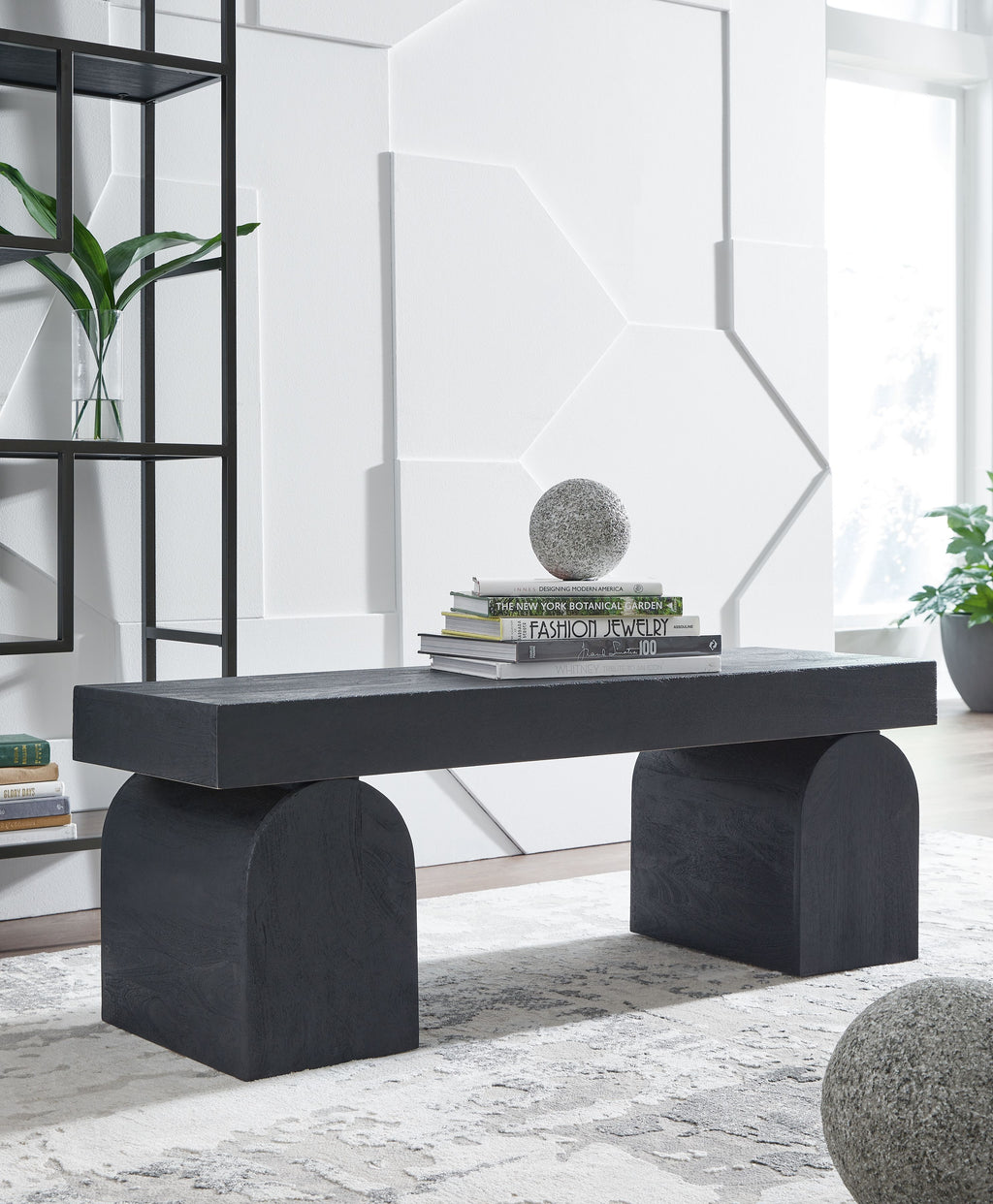 Black accent bench with wide rectangular top and two chunky block legs