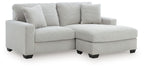 Gray sofa chaise with four back cushions and a chaise ottoman extension