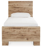 Beige storage bed with a simple headboard and white mattress