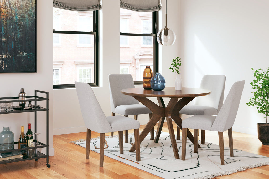 Dining table set with round wood table and four light gray upholstered chairs