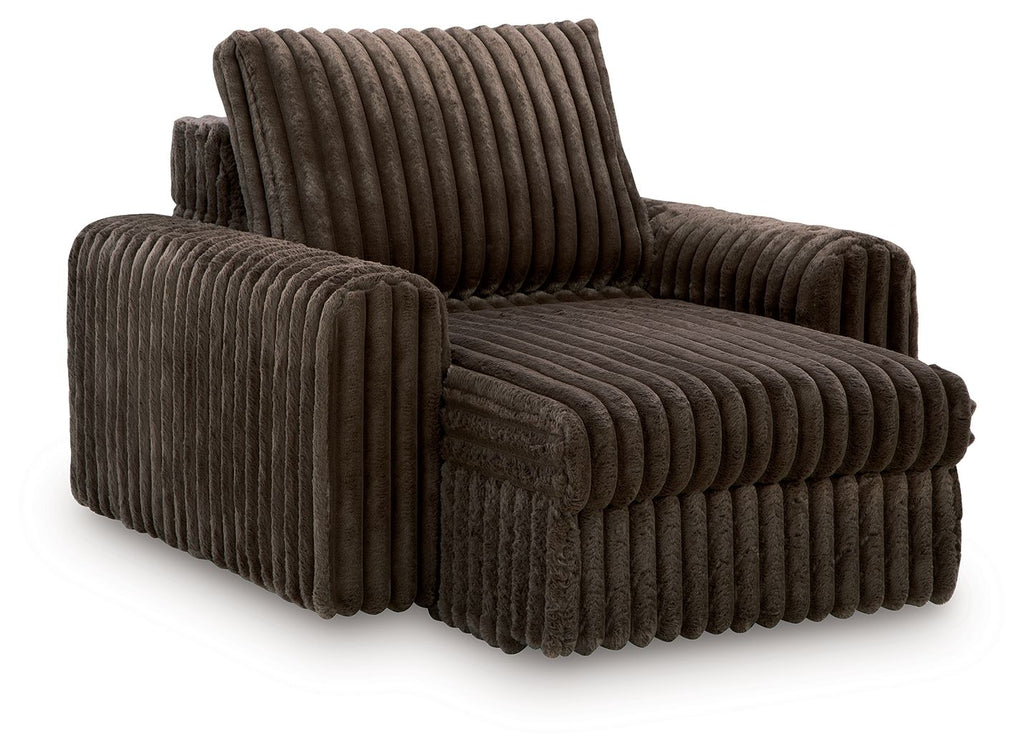 Dark chocolate corduroy chaise lounge with tall backrest and rounded arms
