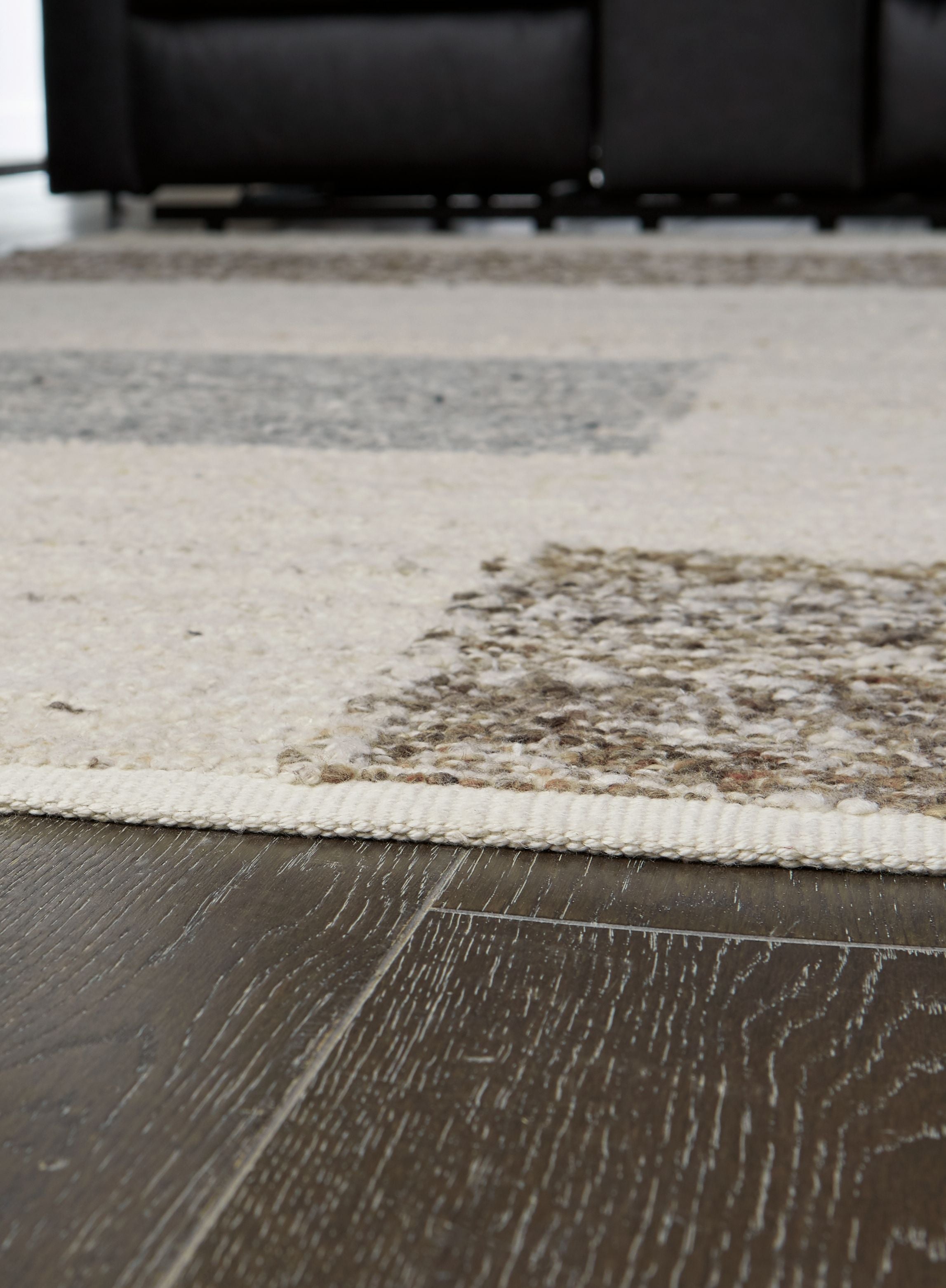 Barus rug with beige texture and gray inset block pattern, stitched edge