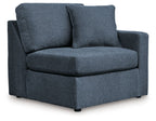 Dark blue fabric corner chair with squared armrests and thick seat cushion