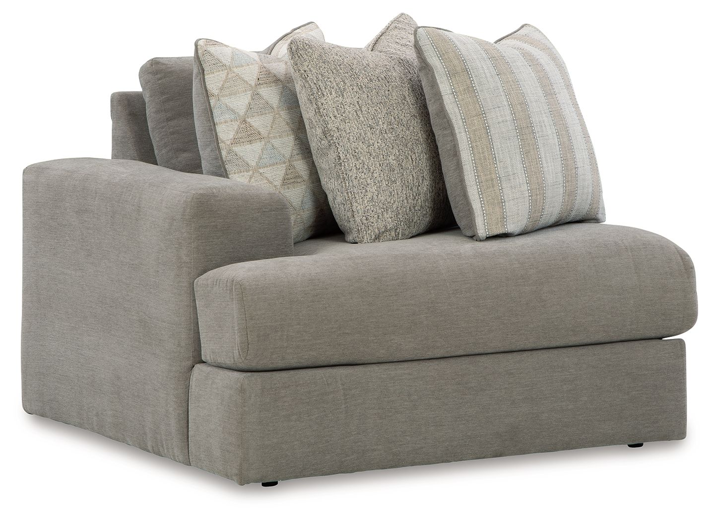Gray upholstered corner chair with three decorative pillows and wide cushioned seat