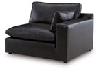 Black RAF corner chair with padded arms and seat cushions, vinyl upholstery