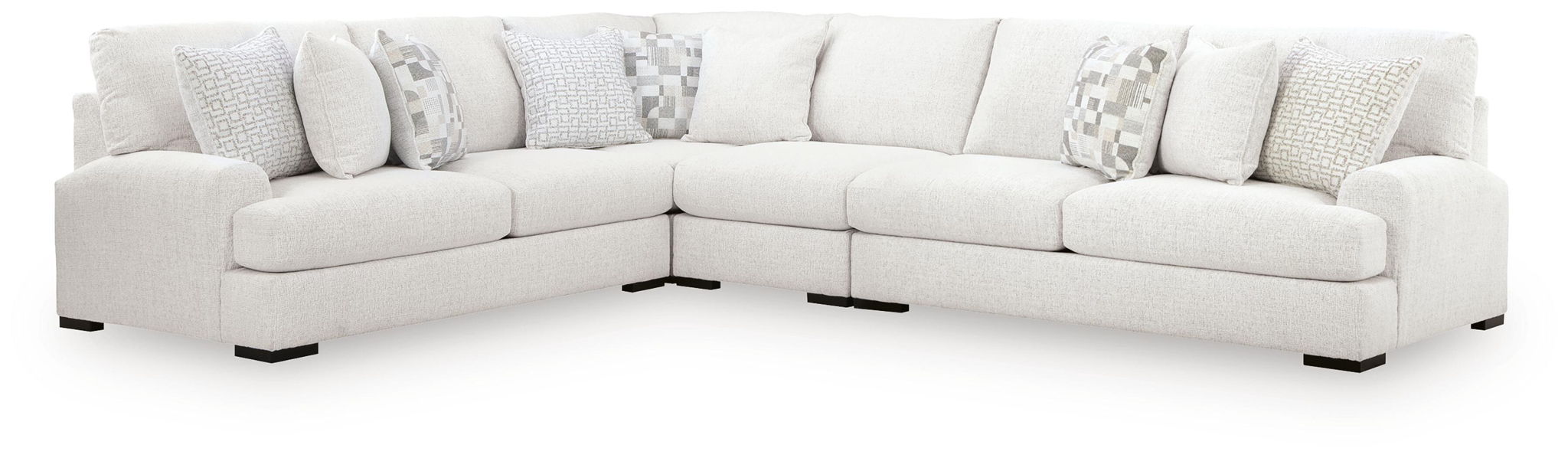 Off-white corner sectional sofa with chaise ends and patterned throw pillows