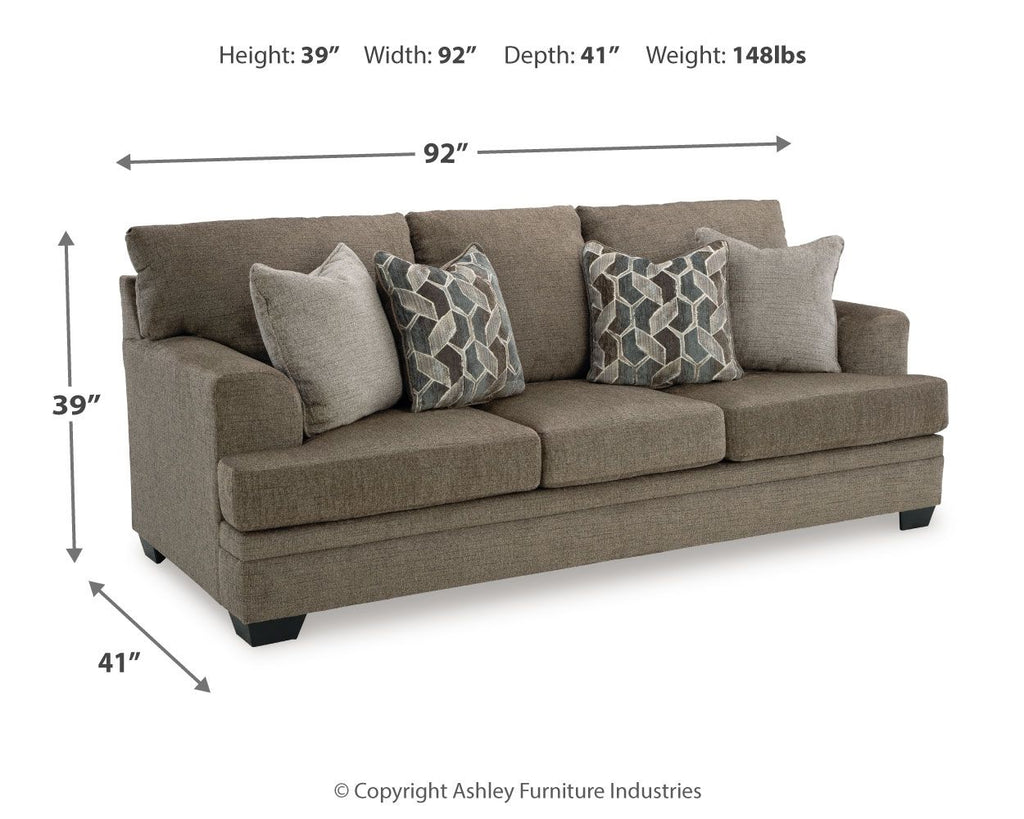 Stonemeade sofa in dark taupe fabric with two geometric accent pillows and two solid cushions