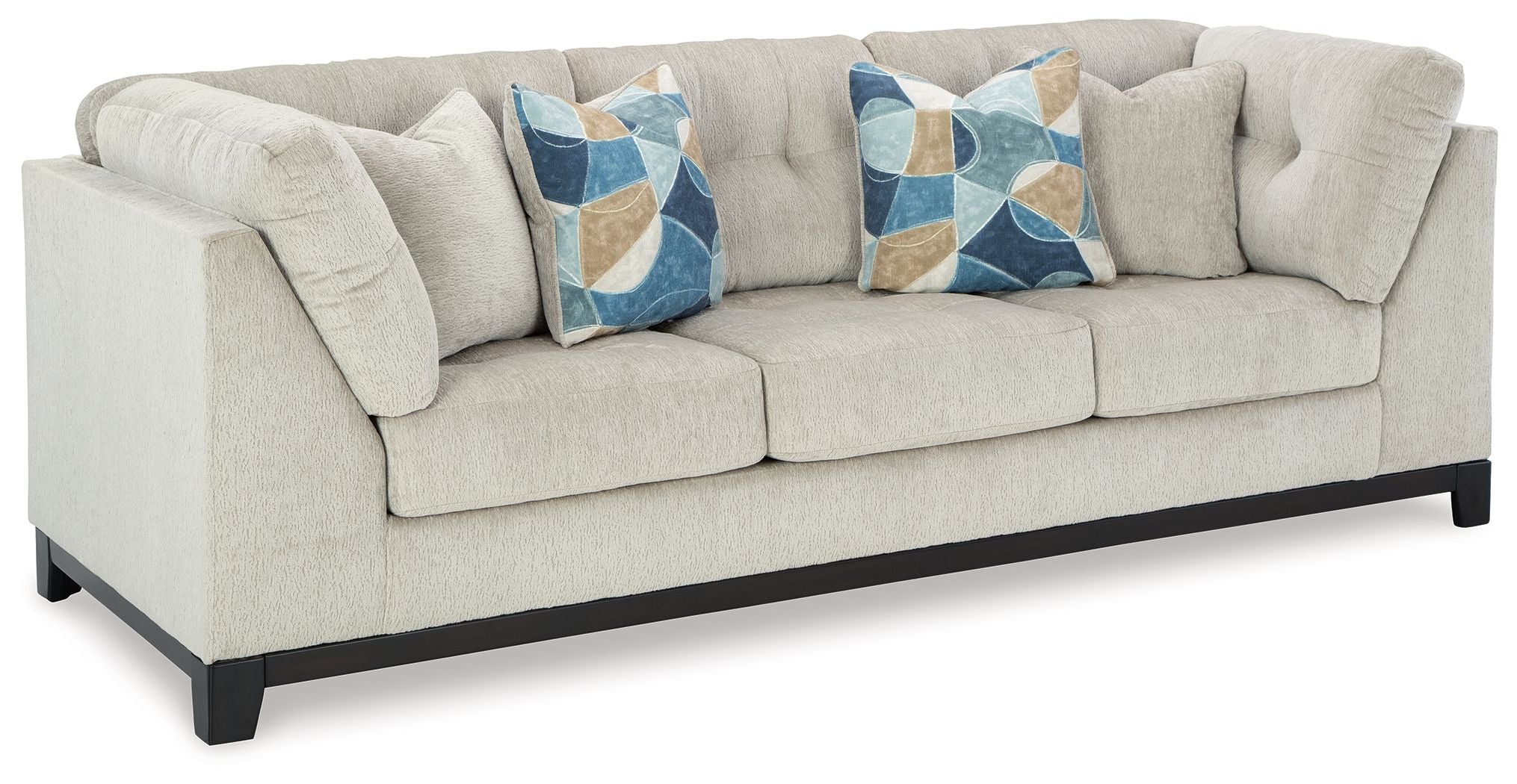 Stone fabric sofa with rolled arms and two decorative geometric throw pillows