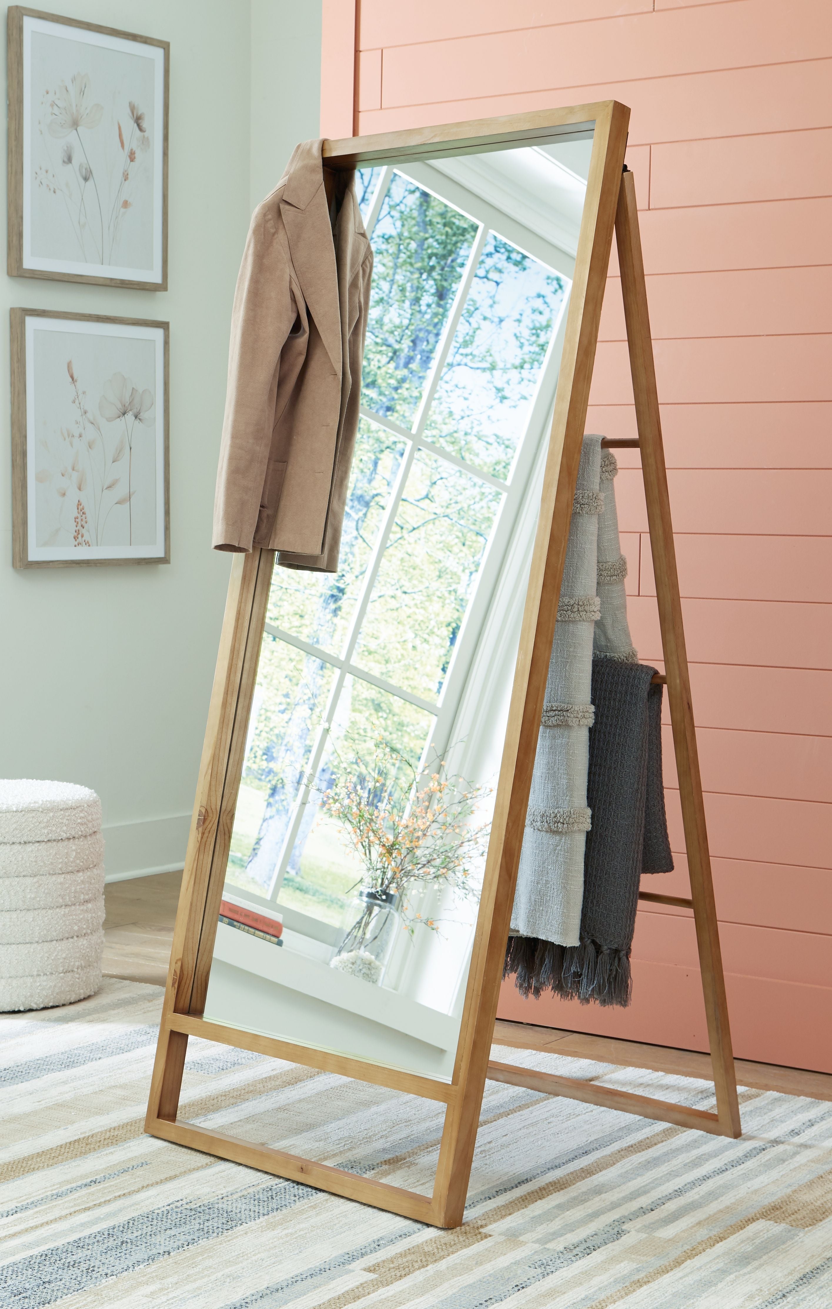 Brown wooden floor mirror leaning with full-length rectangular glass