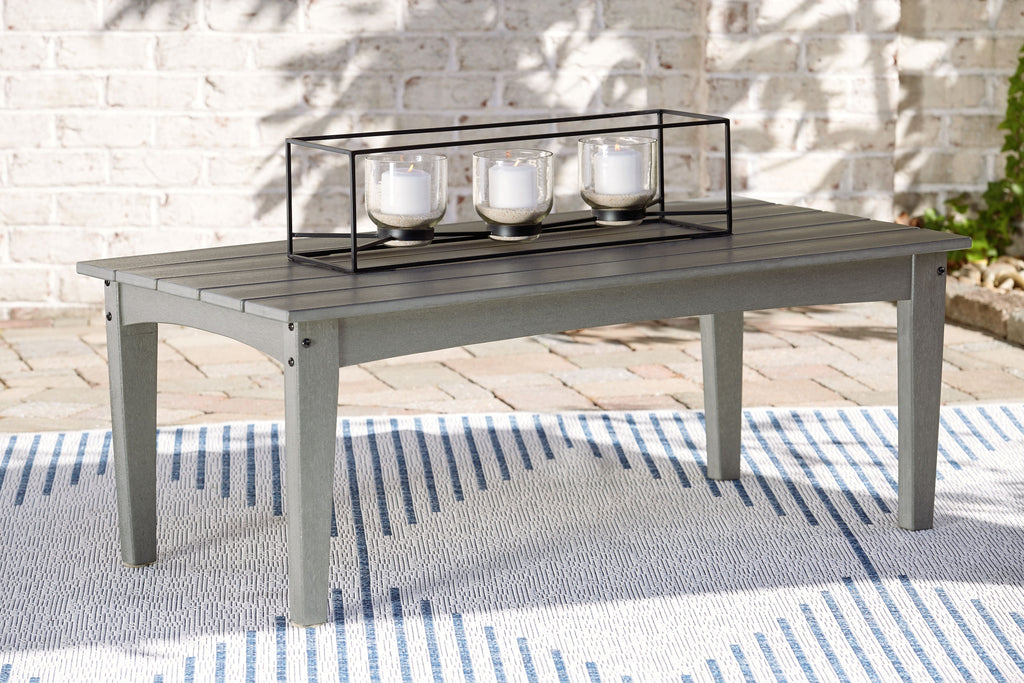 Rectangular outdoor coffee table with gray surface and black metal frame