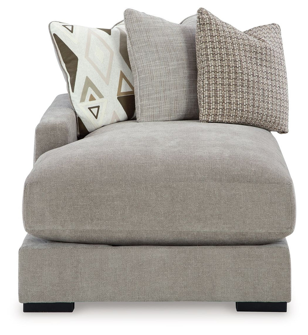 Pebble gray corner chaise with thick seat cushion and textured throw pillows