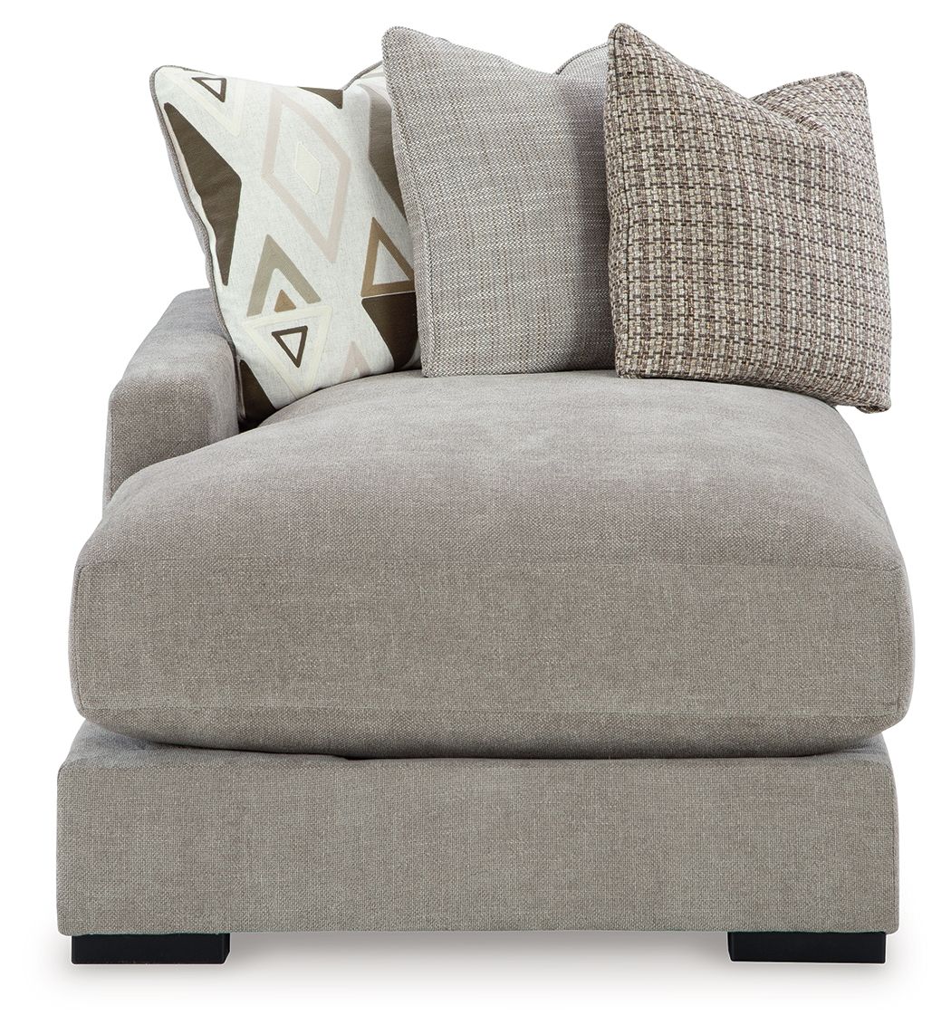 Pebble gray corner chaise with thick seat cushion and textured throw pillows