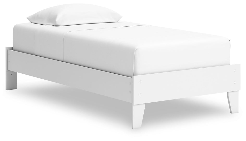 White platform bed with upholstered headboard, low profile frame, and straight legs