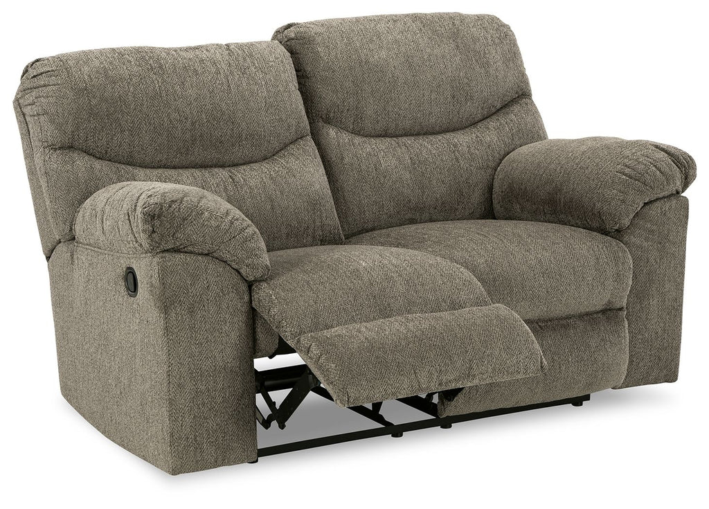 Reclining loveseat in gray fabric with pull-out footrest and rounded armrests