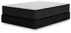 Plush mattress with white quilted top and dark textured sides