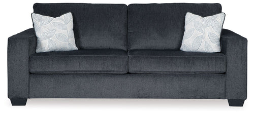 Slate stationary sofa with square arms, tufted back, and two light patterned throw pillows