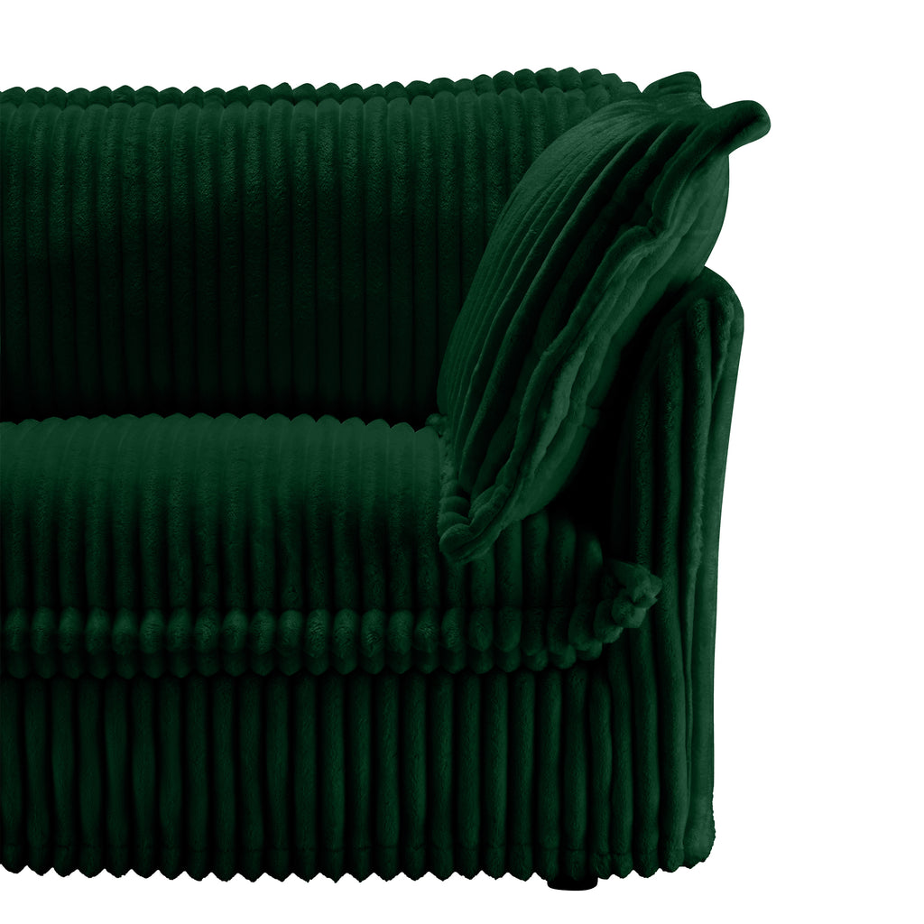 Green sectional side view with ribbed slipcover and draped fabric trim