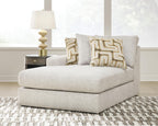 Light beige corner chaise seat with two patterned back cushions