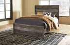 Gray queen bed panel rails with dark upholstered headboard