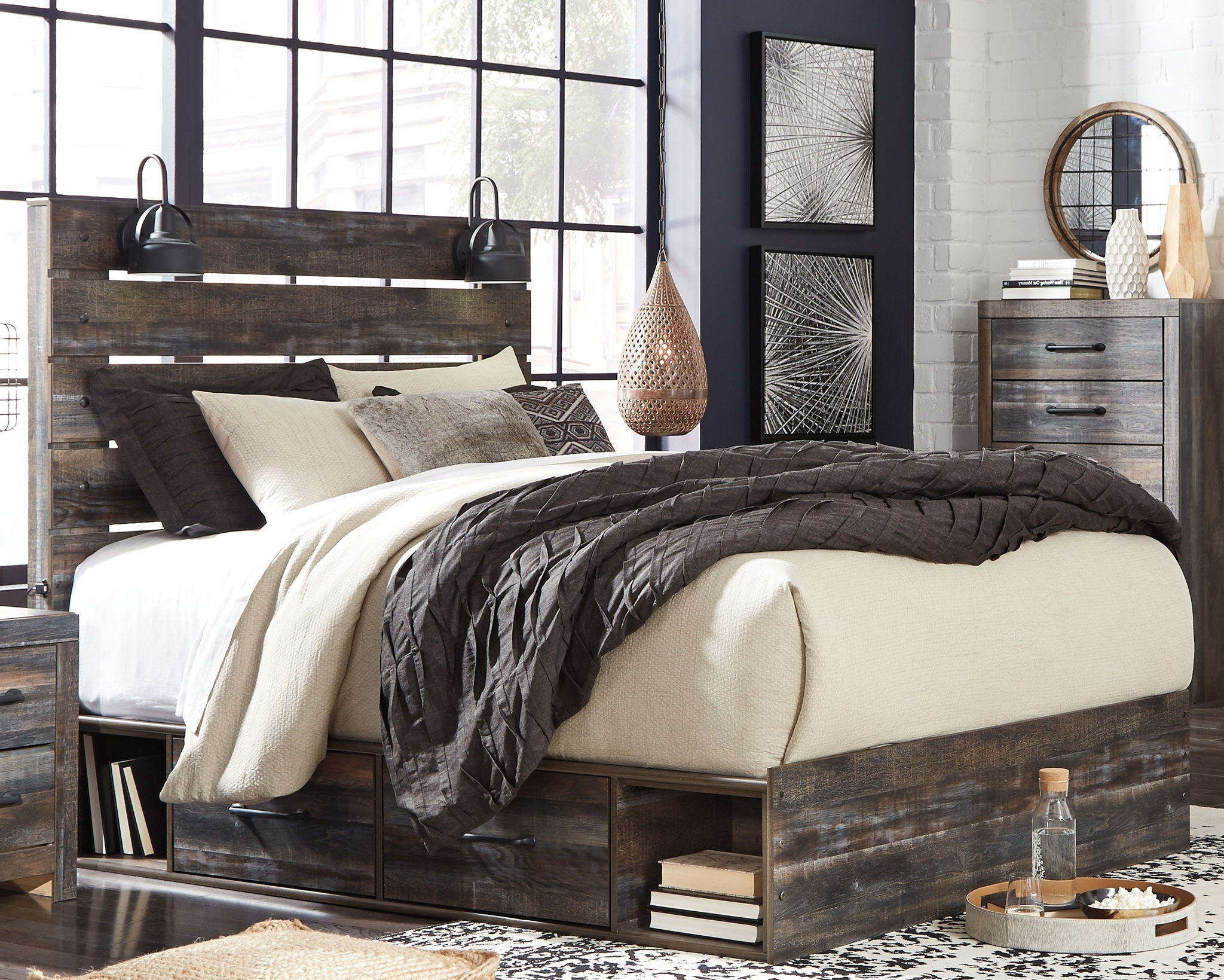 Dark wood panel bed with slatted headboard and side rails, quilted bedding and pillows