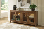 Medium brown accent cabinet with four glass doors and brass handles on low legs